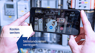 Eine Person, die ein Foto von einer Maschine macht