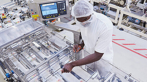 Multi-lane checkweigher for maximum throughput in the smallest of space